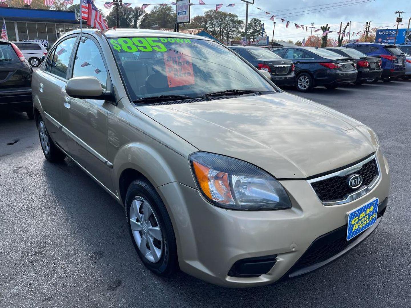 2011 GOLD KIA RIO BASE (KNADH4A34B6) with an 1.6L engine, Automatic transmission, located at 930 E Little Creek Road, Norfolk, VA, 23518, (757) 588-0420, 36.915051, -76.244408 - Photo#0