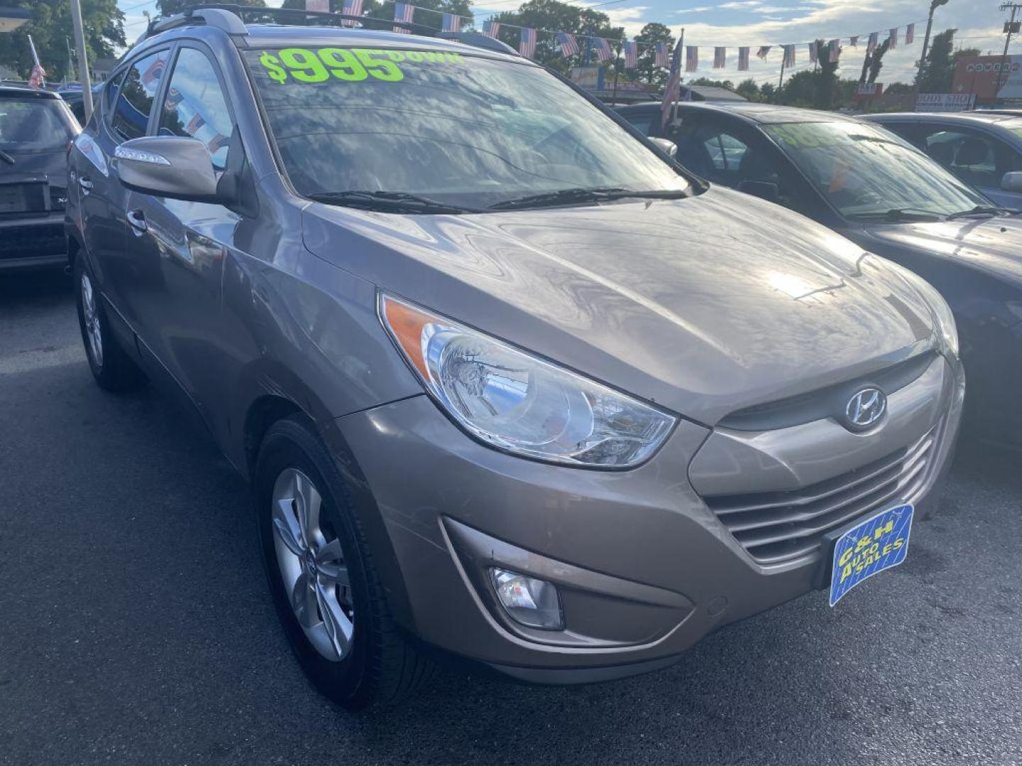 2013 BROWN HYUNDAI TUCSON GLS (KM8JU3AC1DU) with an 2.4L engine, Automatic transmission, located at 930 E Little Creek Road, Norfolk, VA, 23518, (757) 588-0420, 36.915051, -76.244408 - Photo#0